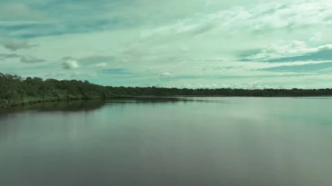 Gliding low over the moody waters of Lake Cootharaba - droning paradise Stock Footage 203884791