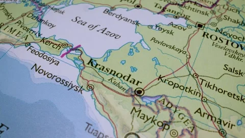Gliding macro view to the azov sea on a physical atlas map Stock Footage 341698907