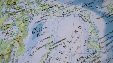 Gliding macro view to greenland on a physical atlas map Stock Footage 341699027