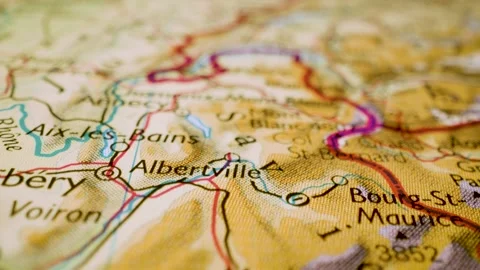 Gliding macro view over physical atlas map leading to Mont Blanc, France Stock Footage 340917295