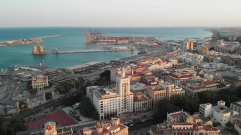 Gliding over Malaga's vibrant port and cityscape at golden hour, revealing .. Stock Footage 344052136
