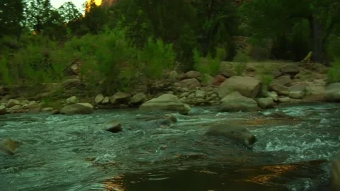 Gliding shot of river through stunning mountains Video stock 74089272