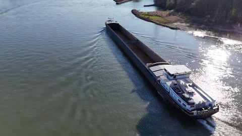 Gliding side view of cargo vessel on sparkling Rhine Stock Footage 331207878