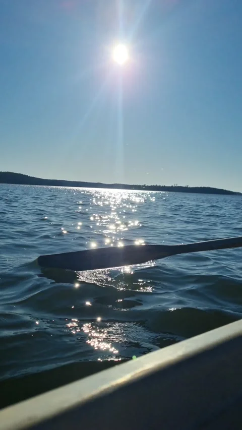"Gliding Through the Afternoon Sun – Rowing on Calm Waters" Stock Footage 307611409