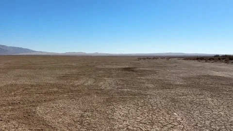 Gliding through Clark Dry Lake bed Stock Footage 318322166