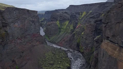 Gliding through a narrow mountain pass with vibrant moss Stock Footage 324969622