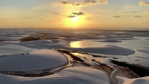 Gliding Through Sunset Lagoon Channels at Lençóis Maranhenses Video stock 342446435