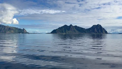 Gliding through the tranquility of the Small Islands of the Lofoten in Norway Stock Footage 323437569