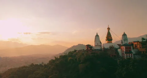 Gliding towards the Monkey Temple as the sun sets, our drone captures the Stock Footage 240606934