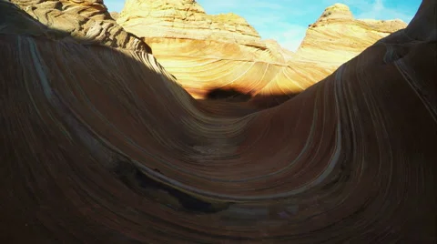 Gliding view walking through the Wave as the sun lights up part of it. Video stock 54054533