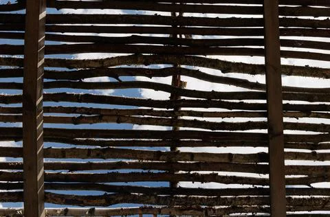 A Glimpse Of Blue Sky Through Rustic Wooden Lattice Stock Photos