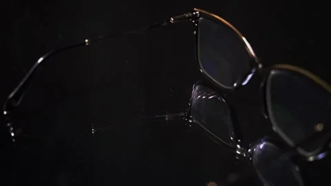 Glimpse of glasses captured from different angles in a dark room at night 스톡 동영상 324839252