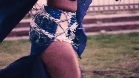 A glimpse of the hips and legs of a beautiful Latina woman dancing Stock Footage 335552789
