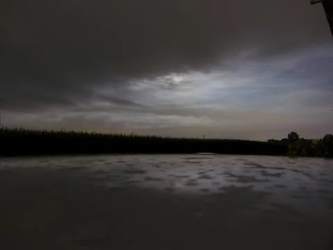 Glimpse of moon in a cloudy night Stock Photos