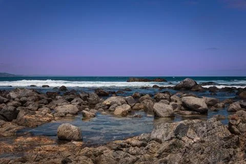 A glimpse of the Pacific Ocean in central Chile at dawn with rocks. Stock-Fotos
