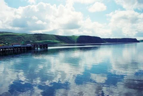 Glimpse of a pier in front of the Scottish hills, A.D. Stock Photos