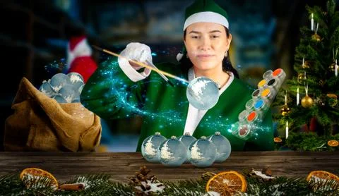 Glimpse into santa's magical workshop how an elf creates Christmas baubles Stock Photos