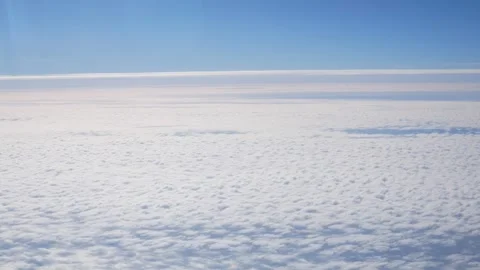 A Glimpse of the Sky From an Airplane Window Stock Footage 268503816