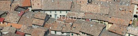 Glimpses of roofs of crowded House a village in southern Europe Stock Photos