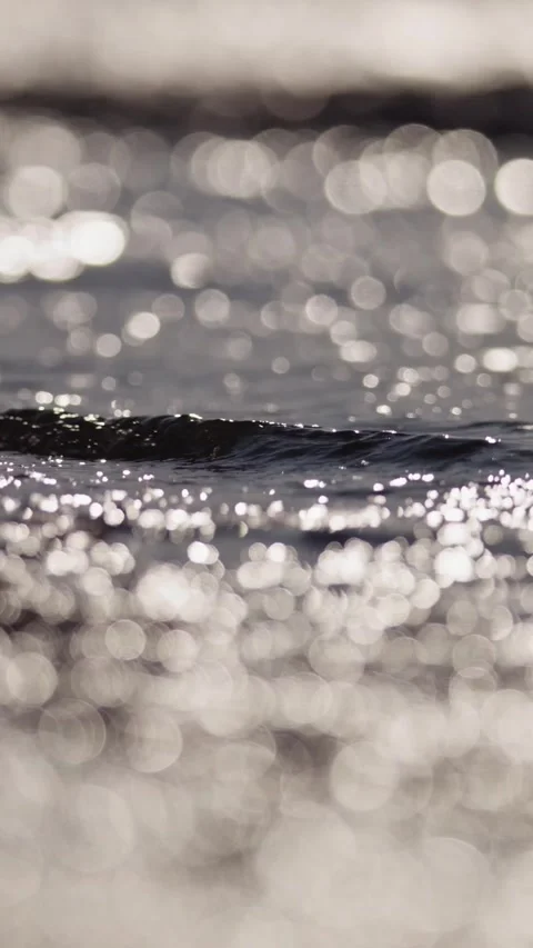 Glistening Light Patterns on a Reflective Water Surface Stock Footage 335197555