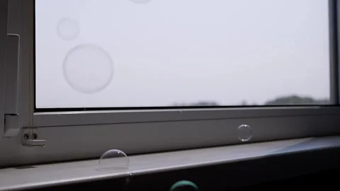 Glistening Soap Bubbles Gracefully Drift Down Window Stock Footage 316179280