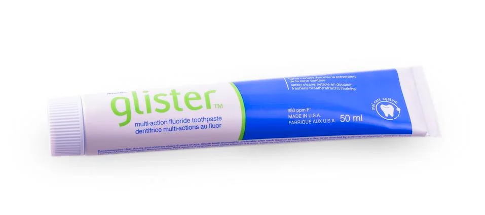Glister toothpaste box on the white background. Stock Photos
