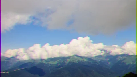 Glitch effect. Clouds over the mountain ridge. Time Lapse. Krasnaya Polyana, Stockbeeldmateriaal 105786795