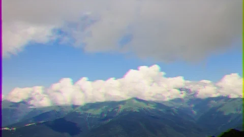Glitch effect. Clouds over the mountain ridge. Time Lapse. Krasnaya Polyana, Vídeo Stock 105786997
