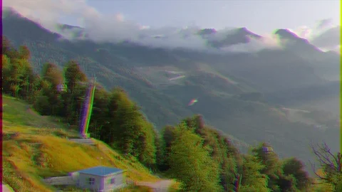 Glitch effect. The slopes of the mountains at sunset. Rosa Khutor, Sochi, Russia Vídeo Stock 107041130