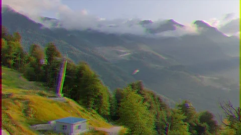 Glitch effect. The slopes of the mountains at sunset. Rosa Khutor, Sochi, Russia Vídeo Stock 107041163
