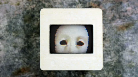 Glitching CRT Television Displaying Eerie White Mask in Retro Horror Style Stock Footage 344908842