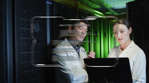 Glitching HUD appearing, two technicians consulting laptop, gesturing and Stock Footage 332523022