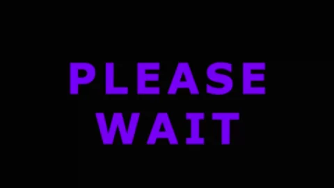 Glitching text 'Please Wait' with digital distortion during loading sequenc.. Stock Footage 343415564