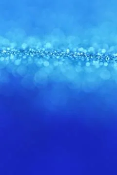 Glitter blue gradient texture with bokeh. classic blue swatch for web design Stock Photos