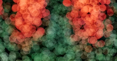 Glitter bokeh from out of focus view of decoration orange, red and green bulbs. Stock Footage 119926144