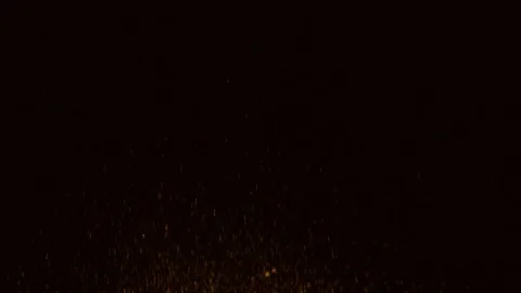 Glitter exploding golden sparkles isolated on black background.Gold glitter dust Stock Footage 99756053