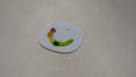 Glitter exploding into a rainbow of colors slow motion time lapse 動画素材 75613123