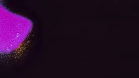 Glitter fluid drip ink spill black purple emulsion Video stock 276327441