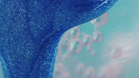 Glitter fluid drip paint flow blue water bubbles Stock Footage 253893000
