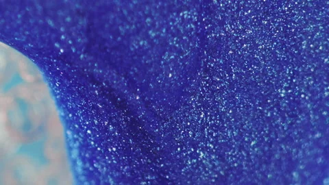 Glitter fluid drip paint flow blue water bubbles Stock Footage 257351996