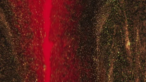 Glitter fluid drip paint mix red bronze ink spill Stock Footage 257513144