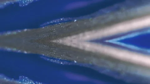 Glitter fluid flow ink spill silver blue paint Stock Footage 284688320