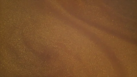 Glitter fluid motion background. Sparkling yellow liquid paint. Shine glitter Stock Footage 274028846