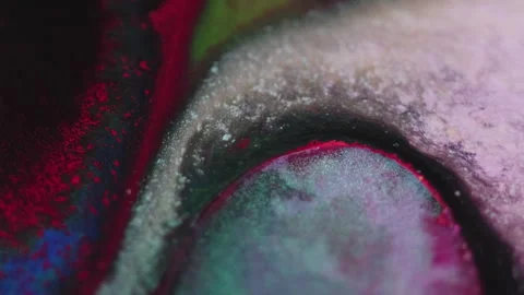Glitter fluid spill oil bubble pink blue paint mix Video stock 272485380