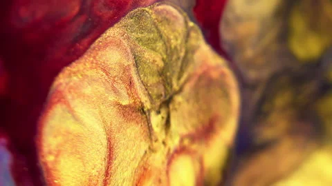 Glitter fluid spill paint flow red purple golden Video stock 285008416
