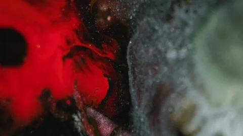 Glitter fluid splash paint flow red black ink mix Stock Footage 282757848