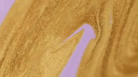 Glitter fluid texture paint flow golden violet mix Video stock 253895429