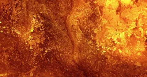 Glitter ink background paint mix golden glow fluid Stock Photos