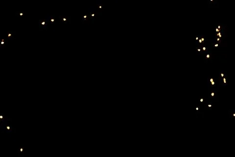 Glitter lights on black background Stock Photos