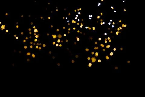 Glitter lights on black background Stock Photos